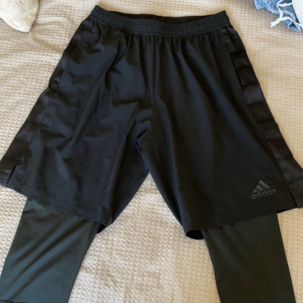 A brand new athletic shorts with tights.